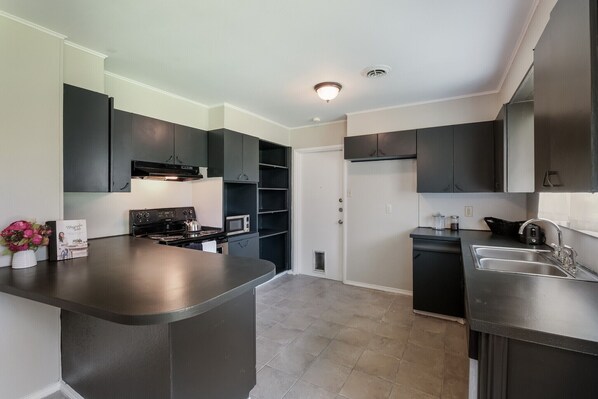 Fridge, oven, stovetop, dining tables