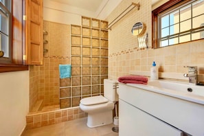 A bathroom with a shower, toilet, and sink. - Remarkable 2-bed House in Arona (Arona)