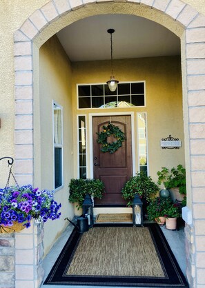 Enter a secure and inviting space with a welcoming archway and a beautifully decorated entrance.