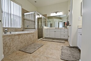 Combined shower/tub, hair dryer, towels, soap