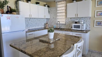 Fridge, microwave, stovetop, coffee/tea maker