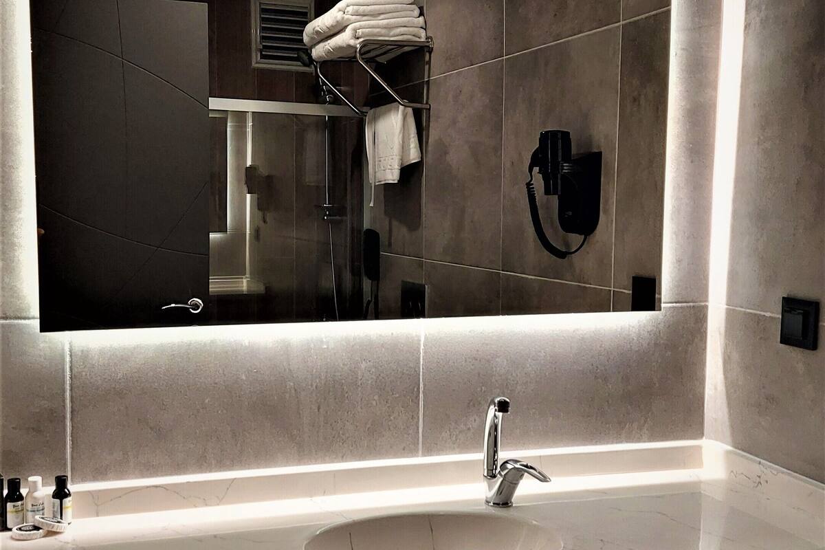 standard room | bathroom | shower, free toiletries, hair dryer, slippers