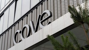 A building facade with a large, bold 'Cove' sign. - Cove Landmark Pinnacle (London)