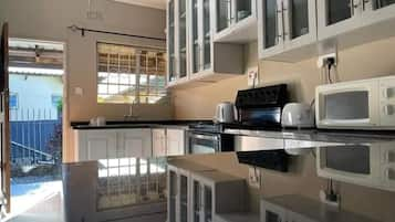 Apartment, 2 Bedrooms, Smoking, Balcony | Private kitchen | Microwave, dining tables