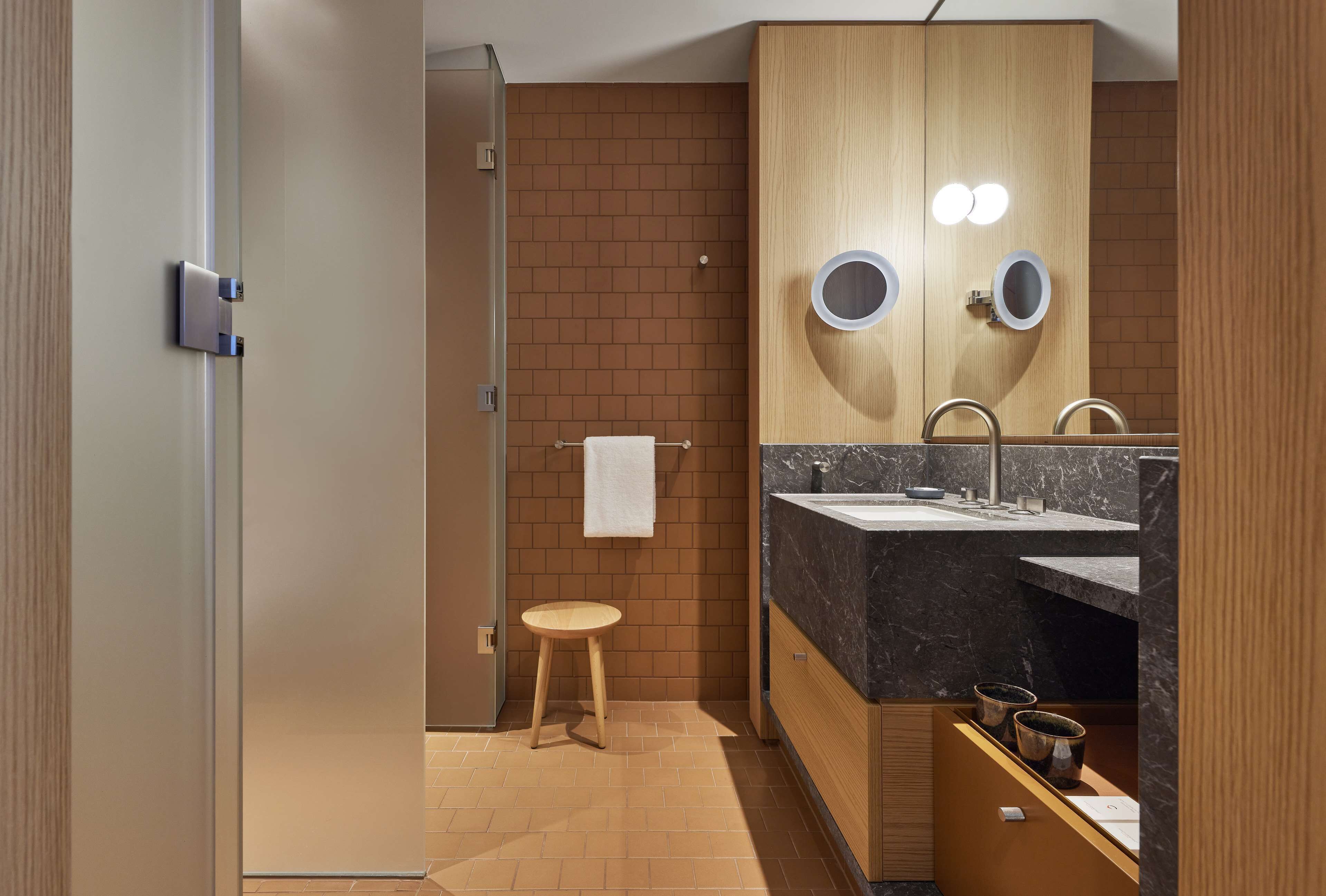 designer toiletries, hair dryer, bathrobes, slippers