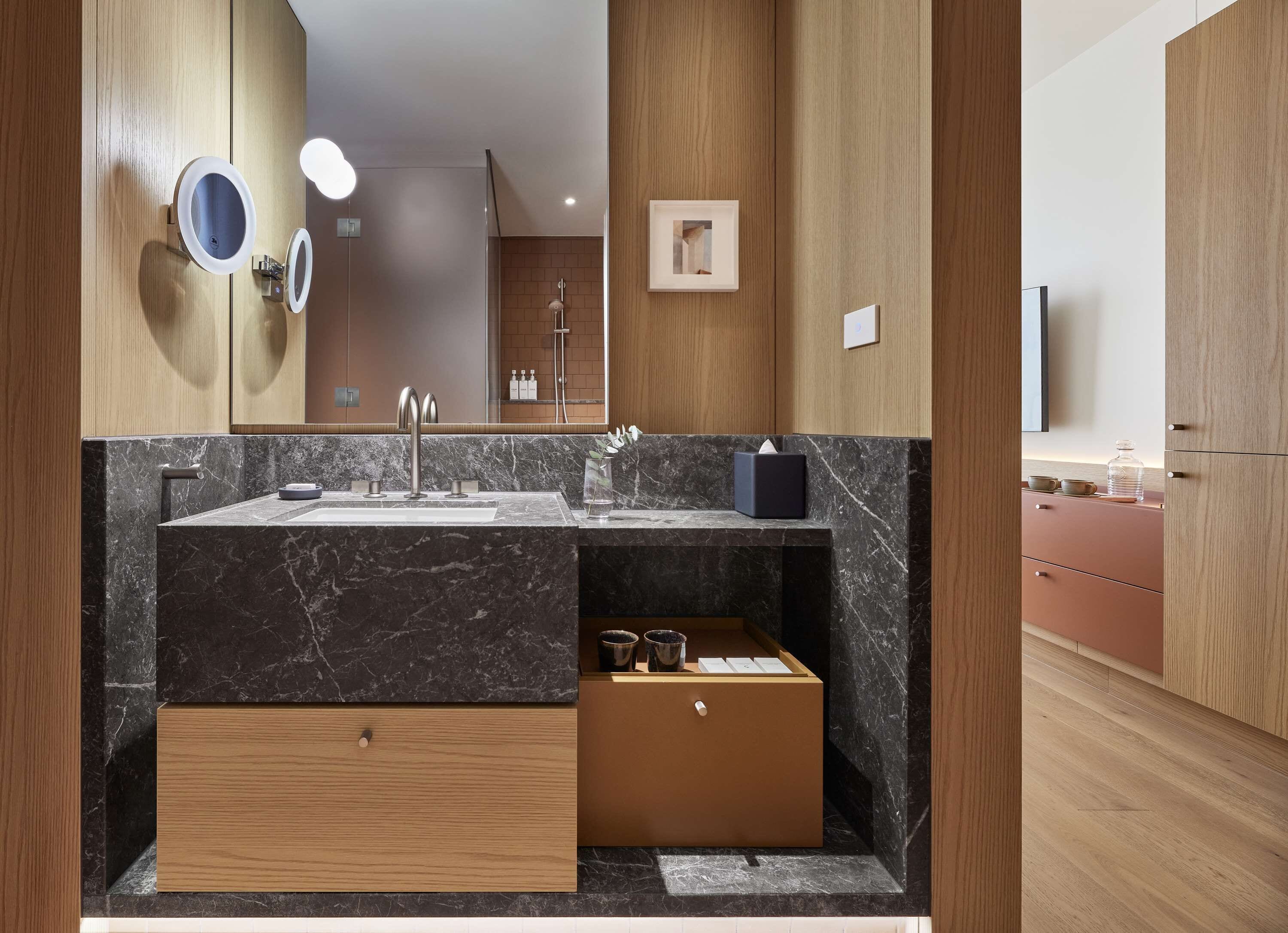 designer toiletries, hair dryer, bathrobes, slippers