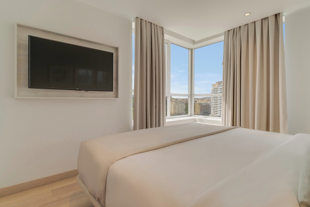 Minibar, laptop workspace, bed sheets