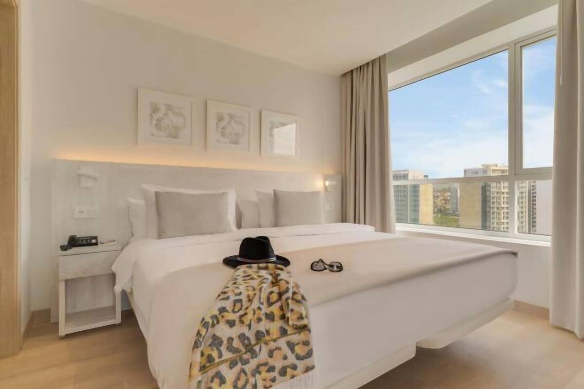 Minibar, laptop workspace, bed sheets