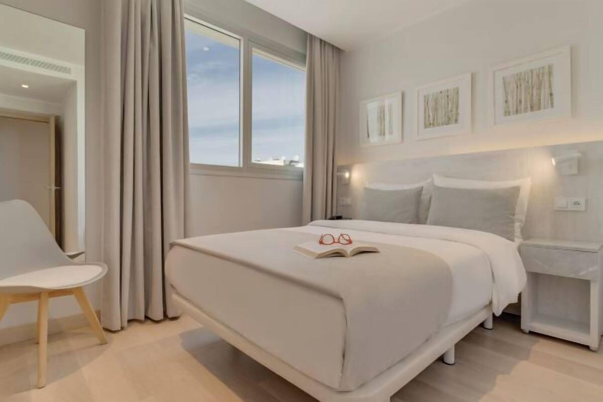 Minibar, laptop workspace, bed sheets