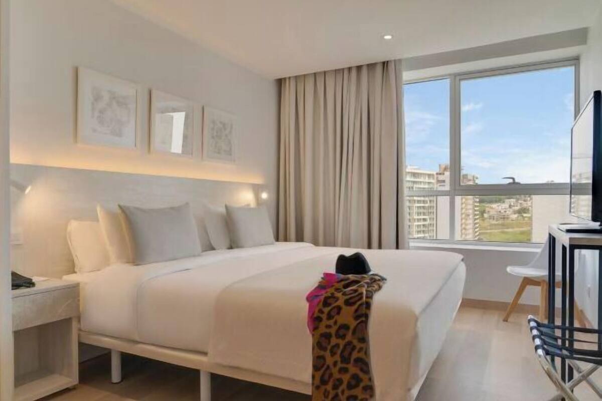 Minibar, laptop workspace, bed sheets