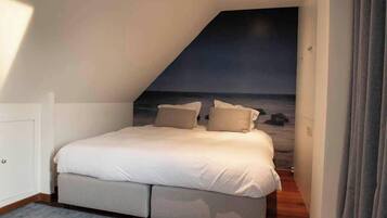 2 dormitorios, tabla de planchar con plancha, cuna de viaje y wifi