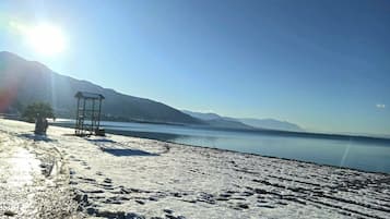 On the beach, sun loungers, beach towels
