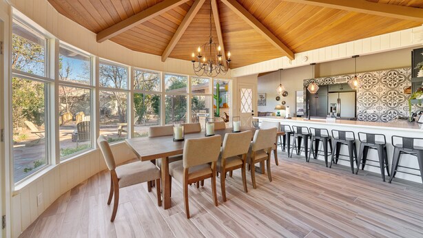 A spacious kitchen with a large island, wooden ceiling, and ample natural light from large windows. - Brand New 2 Bed/2.5 Bath Renovation, Centrally Located in Sedona (Sedona)