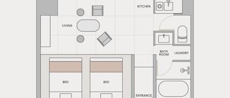 A floor plan of a hotel room with two beds, a living area, kitchen, bathroom, and laundry facilities.