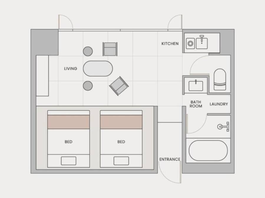 Plano de planta de una habitación de hotel con dos camas, zona de estar, cocina, baño e instalaciones de lavandería.