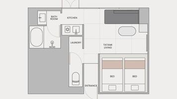 A floor plan of a hotel room with a bathroom, kitchen, laundry area, tatami living space, and two beds.
