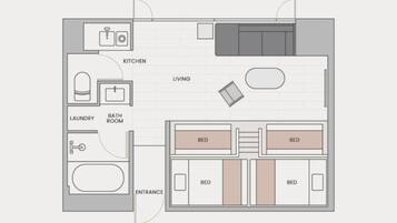 A floor plan of a hotel room with a kitchen, living area, two bedrooms, a bathroom, and an entrance.