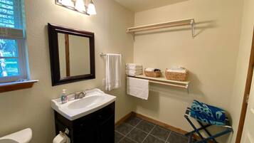 Combined shower/bathtub, hair dryer, towels, soap