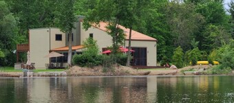 Contemporary home, 4 wooded acres, 200' private lake front, Dock added for 2026!