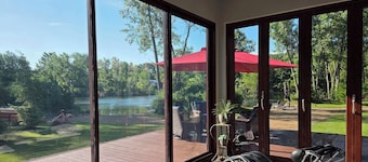 Contemporary home, 4 wooded acres, 200' lakefront; Dock; Backyard; Lake lounge