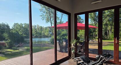 Contemporary home, 4 wooded acres, 200' lakefront; Dock; Backyard; Lake lounge
