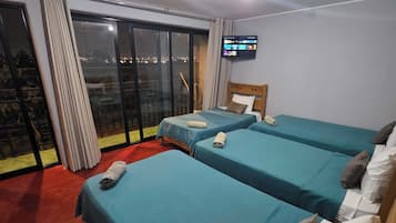 Standard Quadruple Room | Premium bedding, down comforters, pillowtop beds, laptop workspace