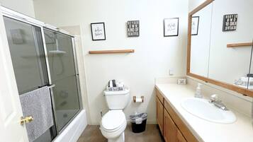 Bathtub, hair dryer, towels, soap