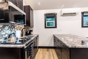 Fridge, coffee/tea maker, cookware/dishes/utensils