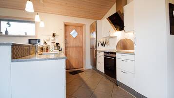 Fridge, stovetop, dishwasher, coffee/tea maker