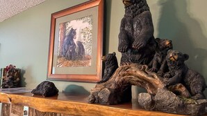 A wooden display with bear sculptures and a framed picture. - Romantic Private Cabin | Hot Tub | Mtn Views, Pets (Sevierville)