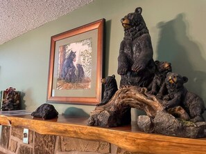 A wooden display with bear sculptures and a framed picture. - Romantic Private Cabin | Hot Tub | Mtn Views, Pets (Sevierville)