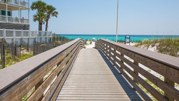 A wooden boardwalk leading to a beach with a clear view of the ocean. - Blue Haven- Beachside condo - 4 minute walk to sand! (Santa Rosa Beach)
