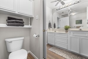 Combined shower/tub, hair dryer, towels, soap