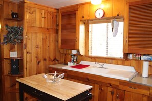 Combined shower/tub, towels, soap, toilet paper - Rustic Chapparal Cabin at Bass Lake Heights (Oakhurst)