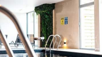 Indoor pool, open 9:00 AM to 10:00 PM, pool umbrellas