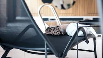 Indoor pool, open 9:00 AM to 10:00 PM, pool umbrellas