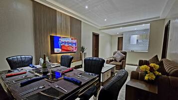 Superior Suite | Living area | Flat-screen TV