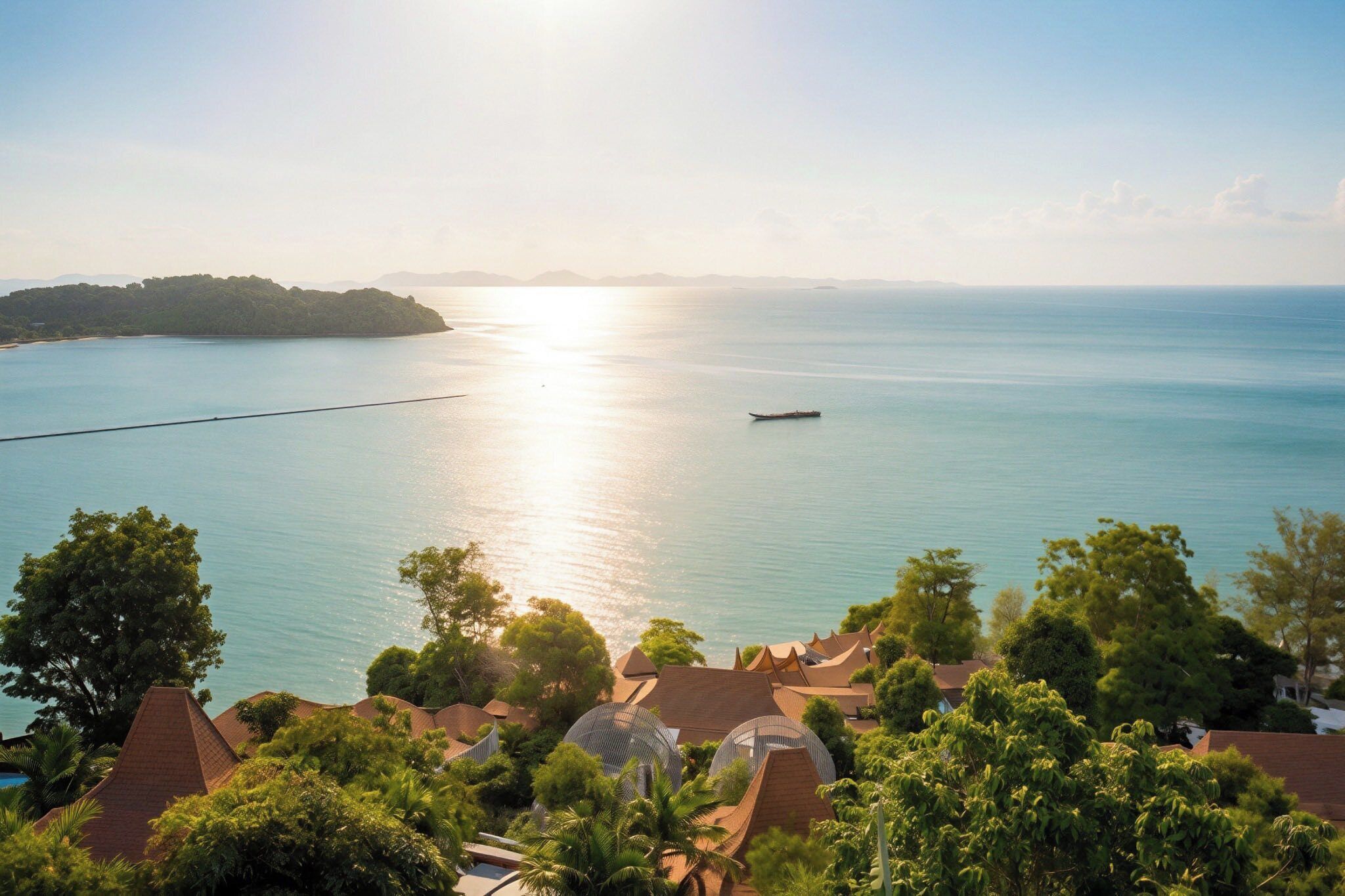 A coastal view with a boat on the water, a peninsula in the distance, and a residential area with traditional architecture.