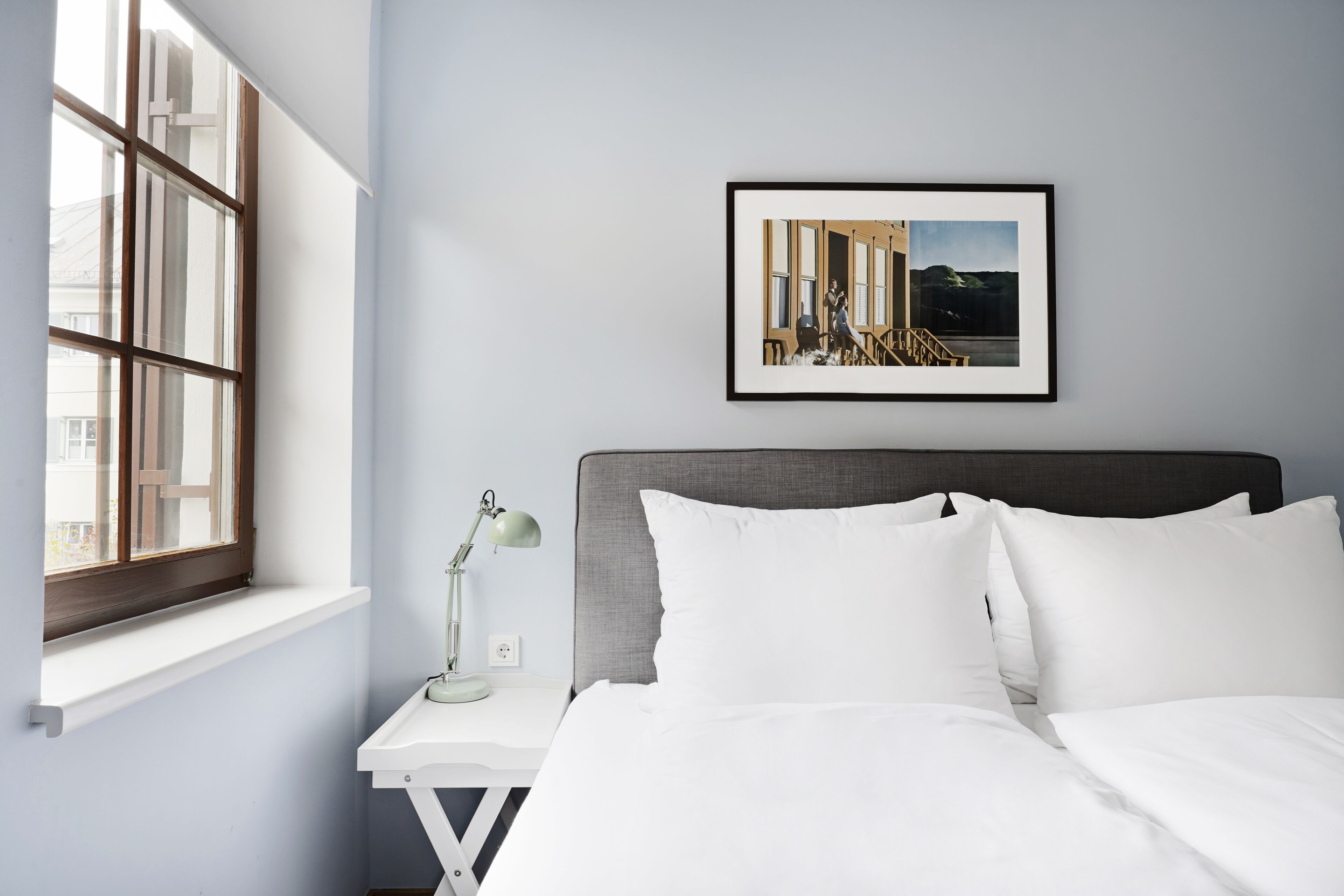 Premium bedding, laptop workspace, iron/ironing board