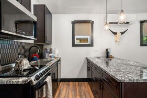 Coffee/tea maker, fridge, microwave, oven