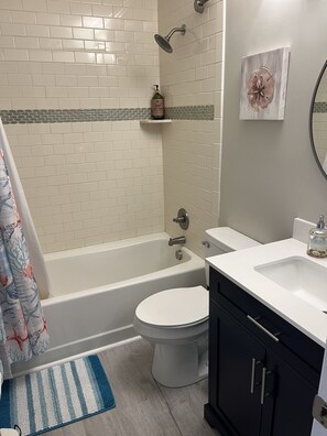Combined shower/tub, hair dryer, towels, toilet paper - Atlantic Beach Condo within walking distance to the beach (Atlantic Beach)