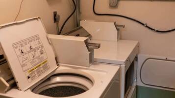 Bathtub, hair dryer, towels