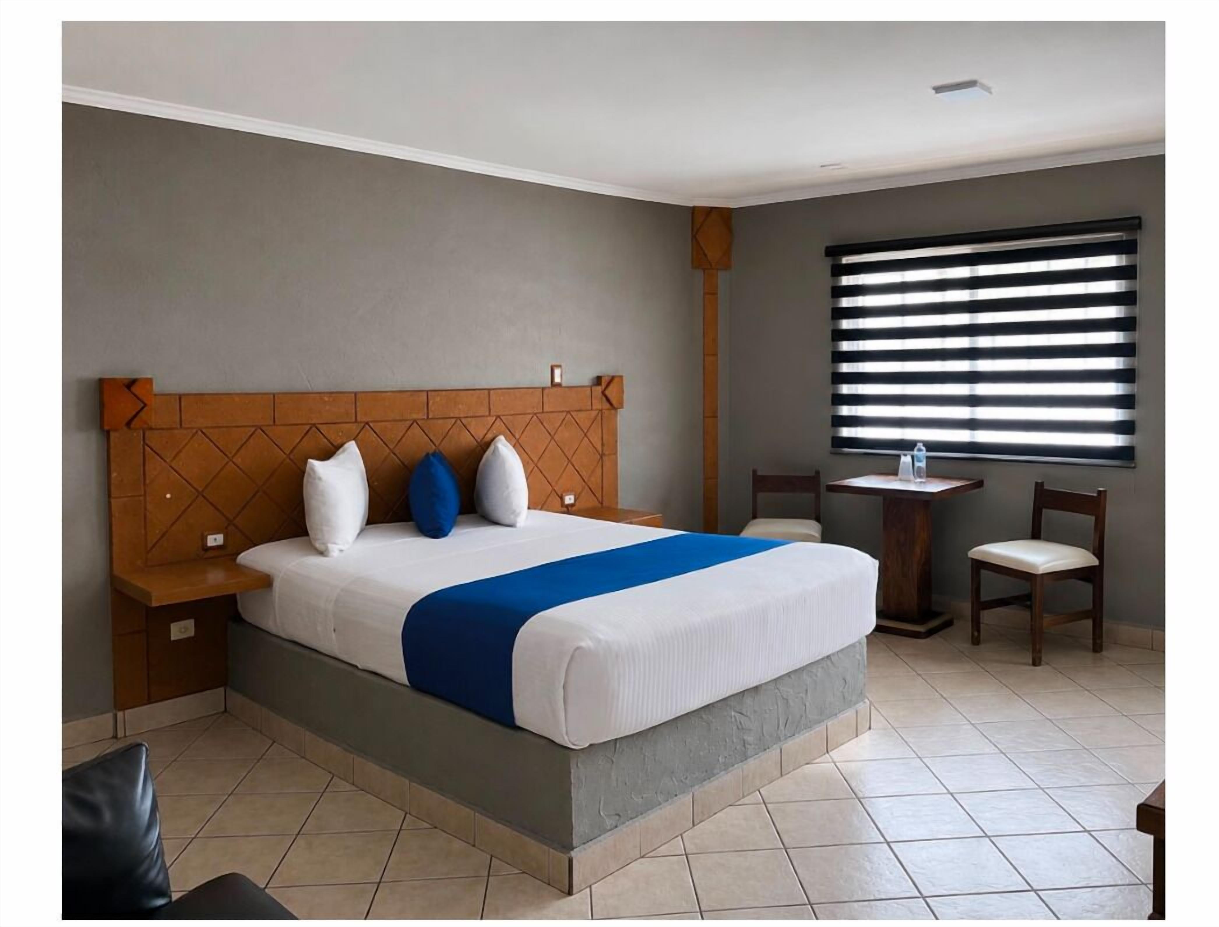 Habitación individual Confort | Ropa de cama hipoalergénica y colchones con acolchado adicional