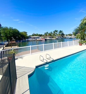 Outdoor pool, a heated pool - NEW LISTING, Walk to beach, waterfront, stunning home (St. Pete Beach)
