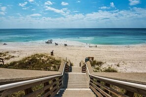 Wooden boardwalk leads to white sands and a peaceful beachscape. - Life's a Beach | Dog Friendly, 2 Pools (Santa Rosa Beach)