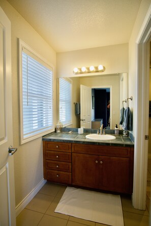 Combined shower/bathtub, hair dryer, towels, soap