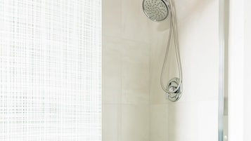Shower, hair dryer, towels, shampoo
