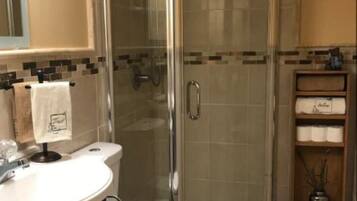 Shower, hair dryer, towels, soap