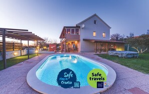 Enjoy a safe and relaxing stay in Croatia with a pool and covered patio.