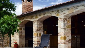A pool with a lounge chair, a stone building with arches, and a chimney. - Villa Smilje Zadarvillas (Posedarje)